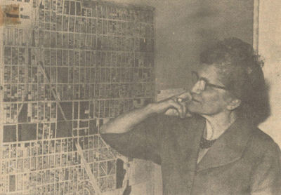 Surprise! . . . Mayor Yvette Courtright, bowing out after three stormy years at the helm of Muskegon Heights, takes a look at a map of her beloved city following her surprise resignation.  She blamed lack of council support as the major reason.